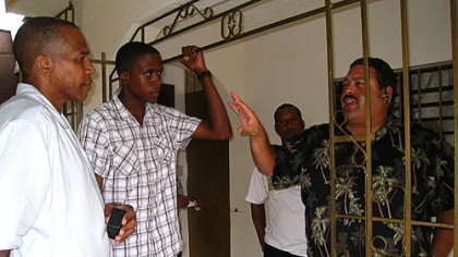 Frias' father, Eugenio, and Frias listen to Rene Gayo explain what Frias' first steps will be in the Pirates' developmental program.