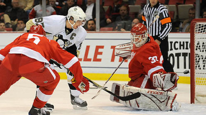 Sidney Crosby beats Detroit goalie Chris Osgood for a goal Tuesday night at Joe Louis Arena.
