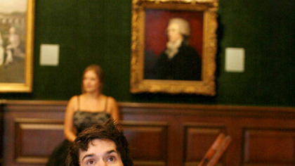 Andrew Hachey (front) and Kristin Slaysman amid Quantum Theatre's "Museum of Desire" that is the Frick Art & Historical Center, Point Breeze