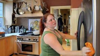 Mrs. Kniess uses an eco-friendly commercial glass cleaner on the stainless refrigerator. A quick buff after cleaning removes residue that could leave streaks.