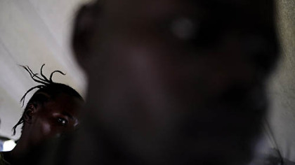 GOMA, Congo -- At left, a woman raped by a soldier from the Armed Forces of Congo looks at her attacker, Sargent Shumbo Chance, foreground, as a military court was sentencing him to life in prison. Several soldiers were sentenced for rape, looting and dereliction of duty.
