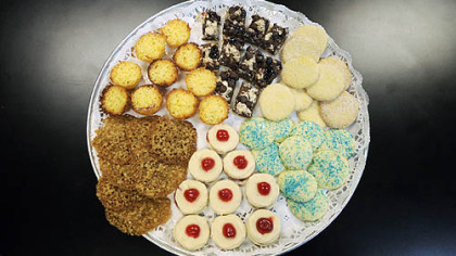 Clockwise from the brown ones at lower left: Butterscotch Lace, Orange Coconut Tartlets, Chocolate Raspberry Crumb Bars, Zaletti (Italian cornmeal), Lemon Ricotta and Scottish Empire Biscuits