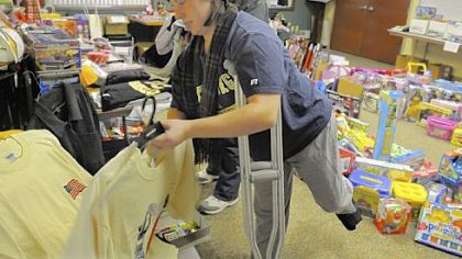Maureen Edwards, of Ross, with her sister, Erin Meadows, looks through items for her three sons at the North Hills Community Outreach.