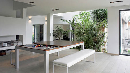 Fusion table with the dining top half on and half off. Price starts at $6,760 for all three finishes (Stainless steel, Powder coated steel and All wood)
