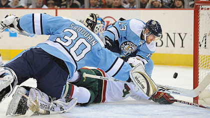 Alex Goligoski makes a save against The Wild in the second period at Mellon Arena last nght.