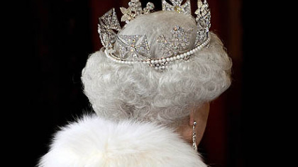 LONDON -- Queen Elizabeth leaves the Palace of Westminster during the State Opening of Parliament. The lavish ceremony, in which she she speaks from a gold throne, wearing an ermine robe and a crown studded with nearly 3,000 diamonds, contrasted with her message of economic caution.