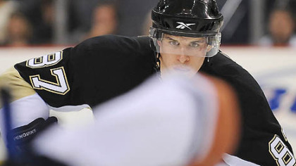 Sidney Crosby eyes up the faceoff against the Oilers at the Mellon Arena thursday. He might not play tonight.