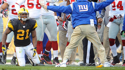 Giants coach Tom Coughlin argues a personal foul call on a hit against the Steelers' Mewelde Moore yesterday at Heinz Field.