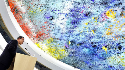 GENEVA -- United Nations Secretary-General Ban Ki-moon delivers a speech under the ceiling painted by Spain's artist Miquel Barcelo during a commemorative session at the assembly hall of the Human Rights Council to mark the 60th anniversary of the adoption of the Universal Declaration of Human Rights, at the European headquarters of the United Nations, Dec. 12.