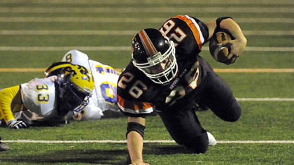 Bethel Park's Lyle Marsh scrambles for a few extra yards in the first half against Canon-McMillan last night.