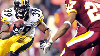 Willie Parker picks up yardage against the Redskins last night. Parker ran for 70 yards with one score in his first game back from knee injury.