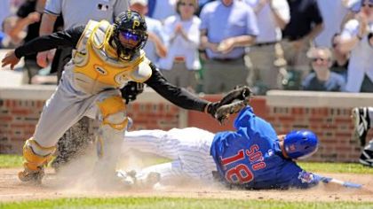 Ronny Paulino tags out Chicago's Geovany Soto at the plate.
