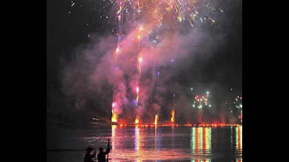 GUILIN, China -- Fireworks explode over a river, at what is called the world's largest outdoor musical, "Impression: Sister Liu Sanjie," is performed in south China's Guangxi Zhuang Autonomous Region.