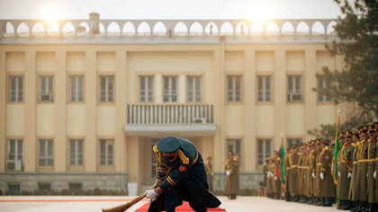 KABUL -- An Afghan guard sweeps in preparation for the arrival of U.S. President George W. Bush and Afghan President Hamid Karzai at the Presidential Palace, Dec. 15.