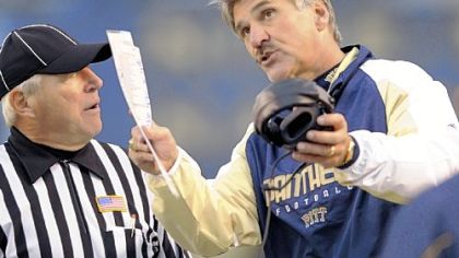 Dave Wannstedt pleads his case on a call with a referee in the second quarter yesterday at Heinz Field.