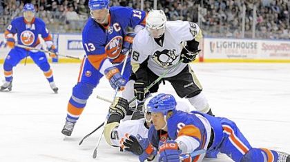 Mike Zigomanis, rear on ice, battles for the puck with the Islanders' Richard Park in their game last night in Uniondale, N.Y.
Dany Sabourin came up big again for the Penguins.