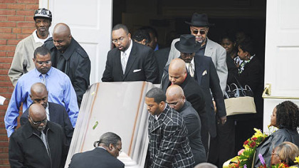 Pallbearers carry Michael Ross III's casket from the Allegheny Center