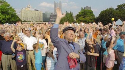 Mr. McFeely waves with the crowd as part of the grand finale to Carl Kurlander's documentary "A Tale of Two Cities."