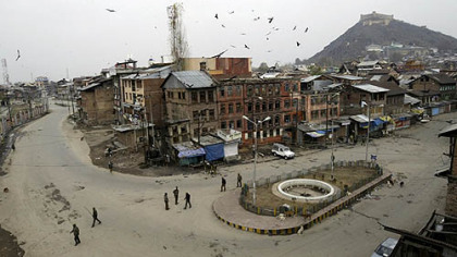 SRINAGAR, India -- Paramilitary soldiers stand guard on an otherwise deserted street in Indian Kashmir. Voting began Monday amid boycott calls by Muslim separatists who say the state elections will only entrench New Delhi's hold on the troubled region. The elections are to be held in seven phases through Dec. 24 in a staggered process that allows the government to deploy thousands of security forces in each area in an attempt to prevent a repeat of violence during elections in 2002 in which dozens died.