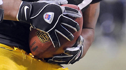 James Harrison comes away with the football after forcing a fumble against Cowboys quarterback Tony Romo yesterday at Heinz Field.