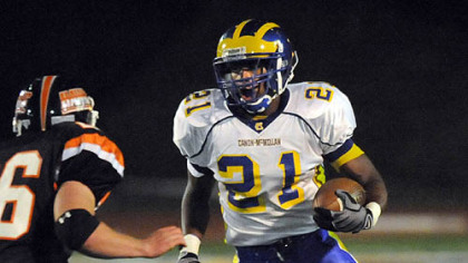 Canon-McMillan's Chad Hagan looks for running room around Bethel Park's Lyle Marsh in the first half last night.