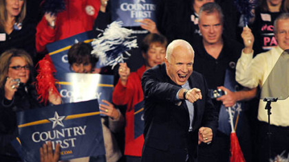 Republican Presidential nominee John McCain waves before speaking this evening at a rally at Robert Morris University's Sewall Center.