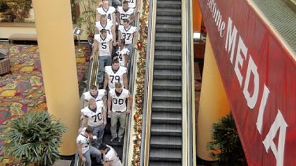 Penn State football players depart a Rose Bowl media day event yesterday in downtown Los Angeles.