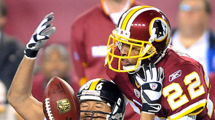 Hines Ward can't pull in a pass in front of the Redskins' Carlos Rogers.