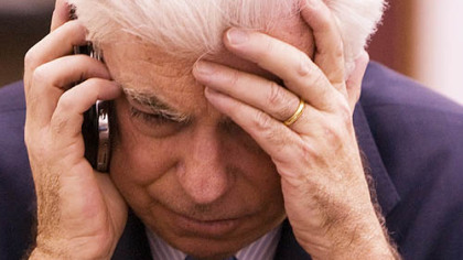 WASHINGTON, D.C. -- Sen. Christopher Dodd, D-Conn., Chairman of the Senate Committee on Banking, Housing and Urban Affairs, makes a phone call following the Senate's rejection of an emergency $14 billion loan bailout for auto companies, Dec. 11.