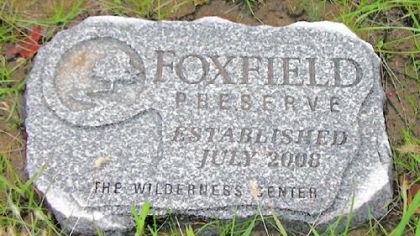 A flat stone marker that families can buy to mark graves at Foxfield Preserve.
