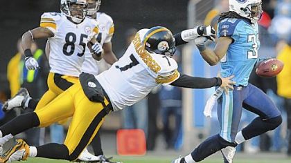 Ben Roethlisberger dives for the Titans' Michael Griffin after he intercepted a pass late in the fourth quarter yesterday at LP Field in Nashville, Tenn.