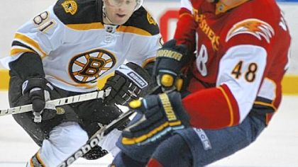 Bruins right wing Philip Kessel, left, skates against Thrashers' defenseman Boris Valabik last night. Kessel is maturing into a game breaker for the Bruins and the Penguins must find a way to contain him in tomorrow night's game.