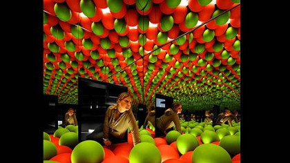 FREIBERG, Germany -- Patricia Tetzner looks at a giant mockup of a mineral's structure at the "terra mineralia" exhibition at Freudenstein Palace. More than 5,000 minerals, gemstones and meteorites from all over the world are presented in the new permanent exhibition.