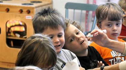 Children in the preschool class taught by Mimi Loughead at DePaul School participate in a Halloween exercise.