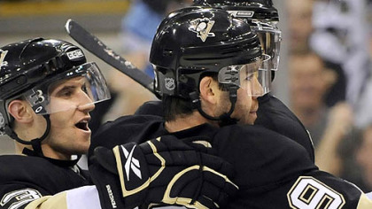 Pascal Dupuis is congratulated by teammate Alex Goligoski after his goal Saturday night. He has been adjusting well to the Penguins' top line.