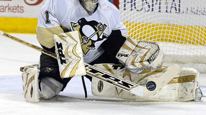 Penguins goalie John Curry makes a save on the Buffalo Sabres during the first period of last night's game in Buffalo. It was his first NHL career start.
