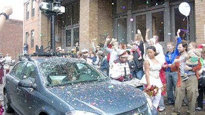 Crowds show off for the camera mounted on a car sent to Sampsonia Way, North Side, to create a street view for Google Maps.