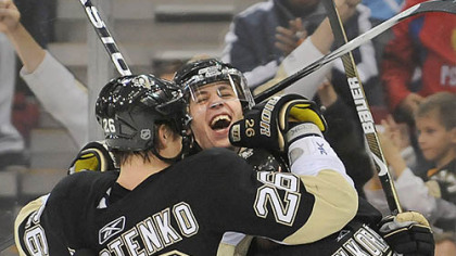 Evgeni Malkin and Petr Sykora congratulate Ruslan Fedotenko on his first-period goal against the Sabres last night.