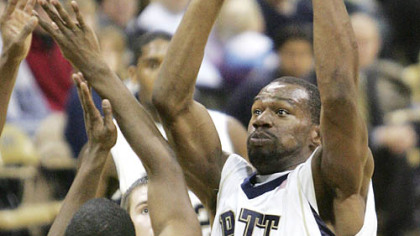 Sam Young looks for an open teammate last night in Pitt's victory at the Petersen Events Center. He seems to be getting some help against Vermont defender Maurice Joseph.