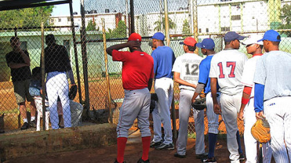 Players line up outside the scouting cage, waiting to introduce themselves to Rene Gayo, the Pirates' Latin American scouting director.