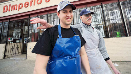 Father and son, Michael and Michael Dimperio, outside the family store yesterday.