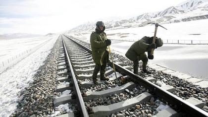 HAIXI, China -- Workers maintain track on the Qinghai-Tibet railway.